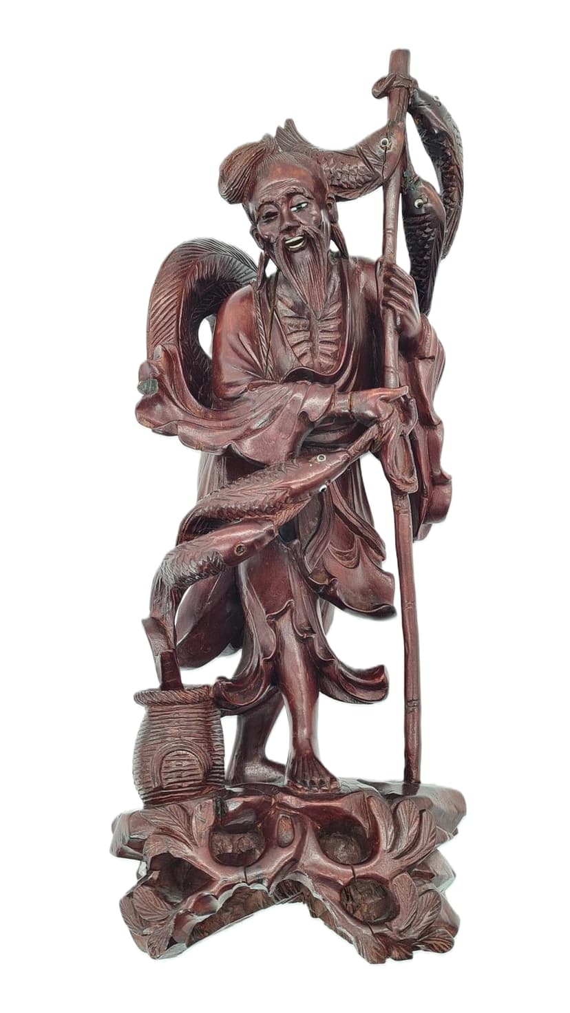 Fisherman figure, dark brown wood, China, 1940s.
